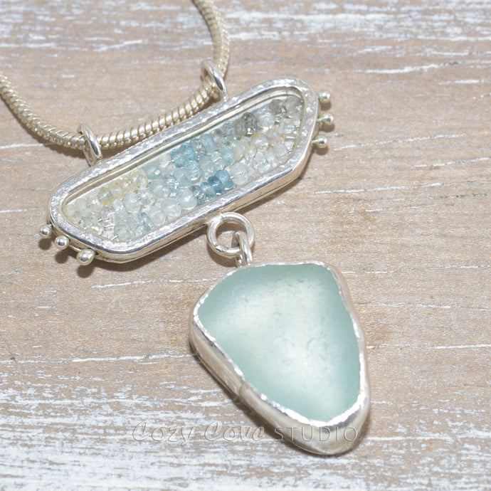 Sea glass pendant necklace in a hand crafted sterling silver setting accented with beryl and aquamarine beads (N636)
