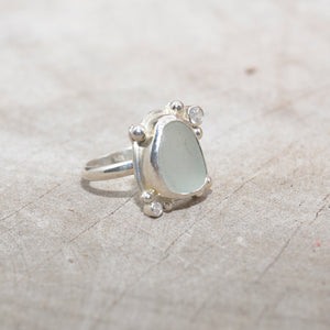 Sea glass ring  accented with  sparkly cubic zirconias  in sterling silver. (R686)