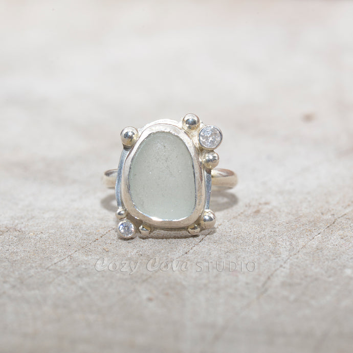 Sea glass ring  accented with  sparkly cubic zirconias  in sterling silver. (R686)