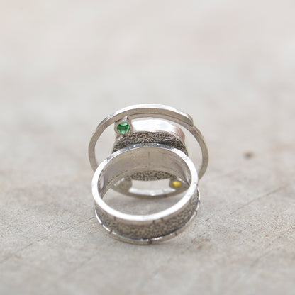 Dichroic glass ring in tones of green and yellow  in a hand crafted setting of sterling silver. (R700)
