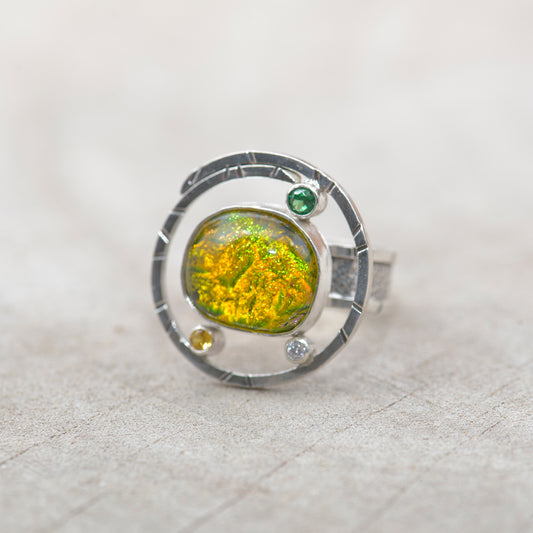 Dichroic glass ring in tones of green and yellow  in a hand crafted setting of sterling silver. (R700)