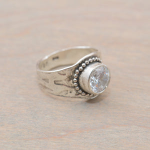 Sparkly cubic zirconia ring in a hand crafted setting of sterling silver. (R705)