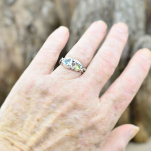 Organic topaz and peridot ring in a hand crafted setting of sterling silver. (R706)