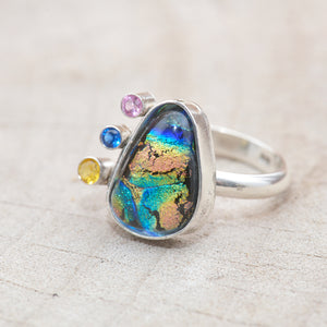 Flashy multi-color dichroic glass ring accented with sparkly cubic zirconias in a hand crafted sterling silver setting. (R707)