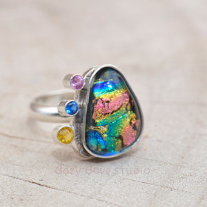 Flashy multi-color dichroic glass ring accented with sparkly cubic zirconias in a hand crafted sterling silver setting. (R707)