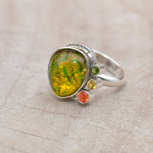 Flashy yellow and green dichroic fused glass ring in a hand crafted setting of sterling silver. (R708)