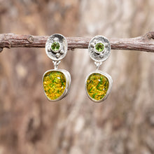 Load image into Gallery viewer, Fiery dichroic fused glass earrings in  hand crafted sterling silver settings accented with a peridot. (E710)

