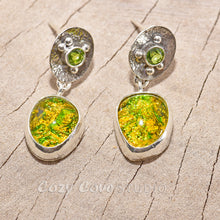 Load image into Gallery viewer, Fiery dichroic fused glass earrings in  hand crafted sterling silver settings accented with a peridot. (E710)
