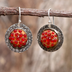 Enamel earrings with textured red dots in settings of sterling silver. (E712)
