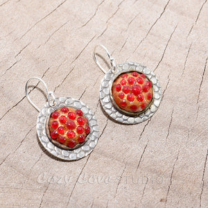 Enamel earrings with textured red dots in settings of sterling silver. (E712)