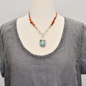 Boho style pendant necklace with turquoise in a hand crafted setting of sterling silver with 14k gold accents and a 14k gold fill bezel. (N723)