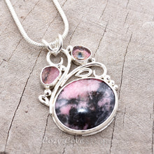 Load image into Gallery viewer, Gemstone necklace with a pink and gray rhodochrosite cabochon and bicolor tourmaline slices in an handcrafted setting of sterling silver. (N737)

