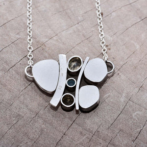 Milk glass and enamel necklace with semi-precious gemstones in a hand crafted setting of tarnish resistant sterling silver. (N740)