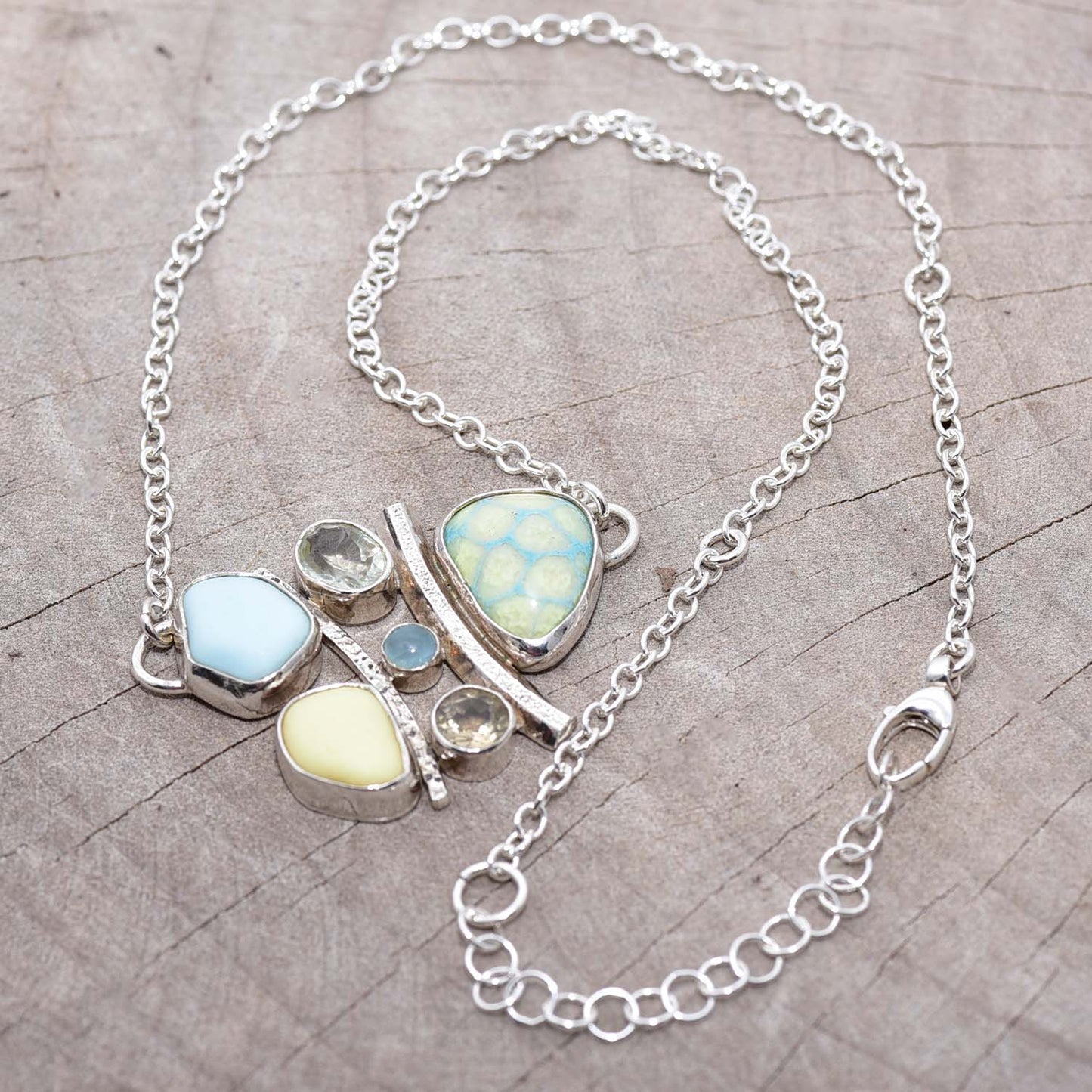 Milk glass and enamel necklace with semi-precious gemstones in a hand crafted setting of tarnish resistant sterling silver. (N740)
