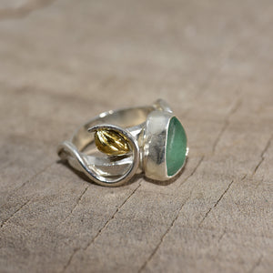 Sea glass ring in a handcrafted setting of sterling silver accented with 18K gold plate. (R761)