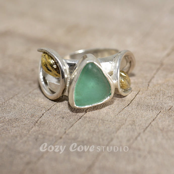 Sea glass ring in a handcrafted setting of sterling silver accented with 18K gold plate. (R761)