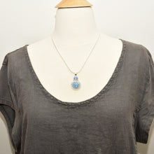 Load image into Gallery viewer, Pendant necklace with hand made enamel cabochon in blue over pale yellow in a hand crafted setting of sterling silver. (N765)
