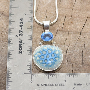Pendant necklace with hand made enamel cabochon in blue over pale yellow in a hand crafted setting of sterling silver. (N765)