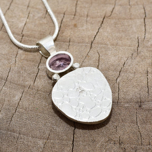 Pendant necklace with handmade enamel cabochon in pale pink and purple  in a hand crafted setting of sterling silver. (N767)