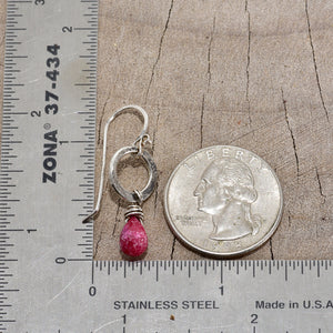 Earrings of hand wire wrapped ruby briolettes dangle from circles of hand forged sterling silver (E779)