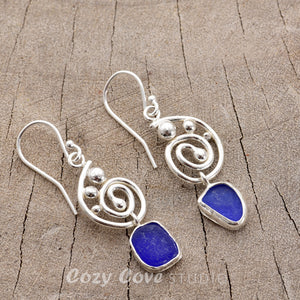 Cobalt blue sea glass dangle earrings in hand crafted settings of sterling silver (E780)