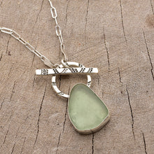 Load image into Gallery viewer, Pale green sea glass necklace in a hand crafted setting of sterling silver. (N785)
