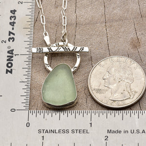 Pale green sea glass necklace in a hand crafted setting of sterling silver. (N785)