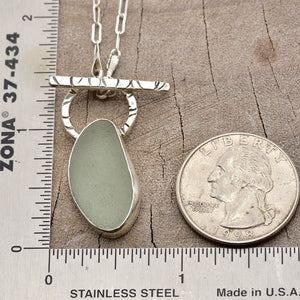 Pale green sea glass necklace in a hand crafted setting of sterling silver. (N788)