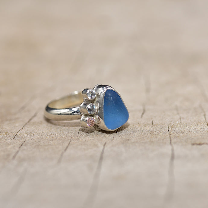 Sea glass ring in cornflower blue with sparkly cubic zirconia side stones (R808)