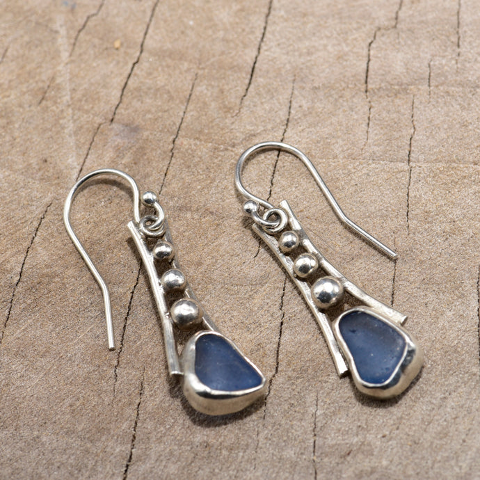 Sea glass earrings in cornflower blue in handcrafted settings of sterling silver (E812)