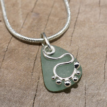 Load image into Gallery viewer, Sea glass pendant necklace accented with a handcrafted sterling silver charm. (N814)
