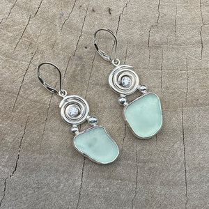 Sea glass earrings in hand crafted settings of sterling silver accented with sparkly cubic zirconias. (E823)
