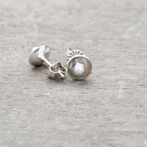 Pearl stud earrings in handmade sterling silver bezel settings. (E88)